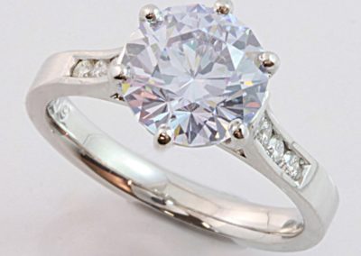 18 carat white gold diamond and purple cubic zirconia engagement ring