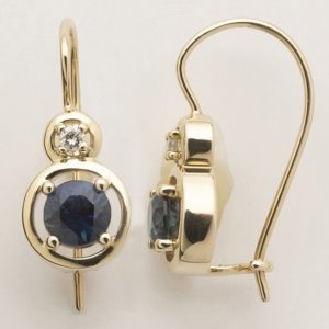 Australian sapphire and diamond 'halo' earrings in 9 carat yellow gold.