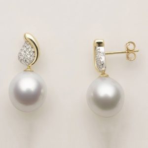 18 carat white and yellow gold pavé set diamond 'leaf' shaped studs with suspended pearl drops.