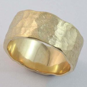 Gents solid 'beaten finish' wedding ring in 18 carat yellow gold