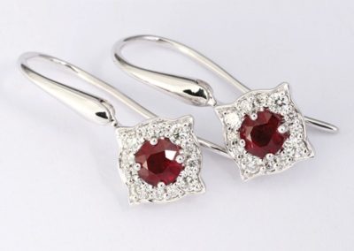 White gold ruby and diamond drop earrings.