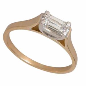 Emerald cut diamond ring in 18 carat yellow and white gold.