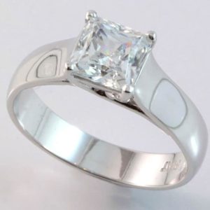 Platinum solitaire princess cut diamond ring.