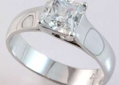 Platinum solitaire princess cut diamond ring.