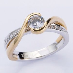 18 carat yellow and white gold diamond ring with wrap around shoulders.
