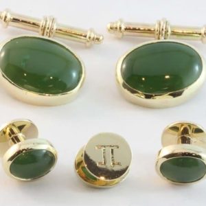 Matching cufflinks and dress studs made from yellow gold and jade