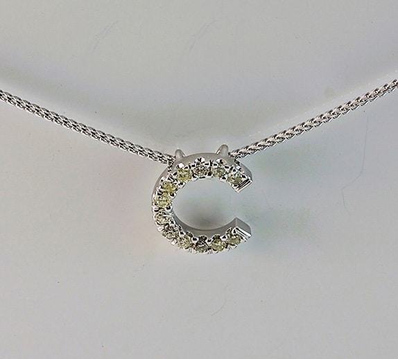C shaped diamond pendant
